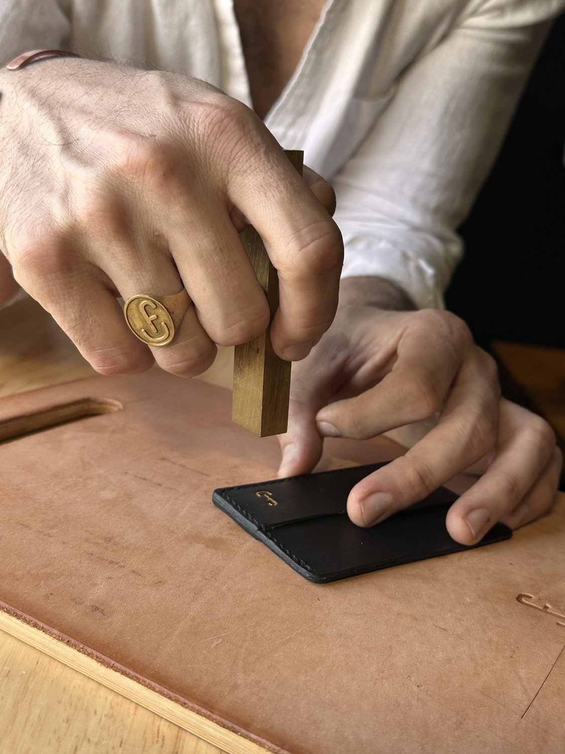 Striking the maker's mark by hand