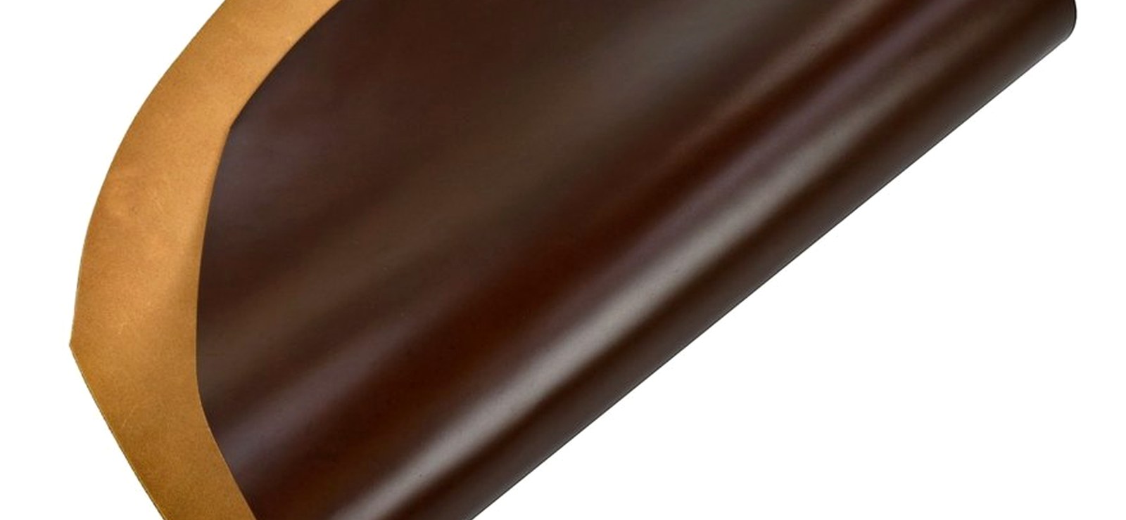 A rolled piece of glossy shell cordovan catching low, warm light