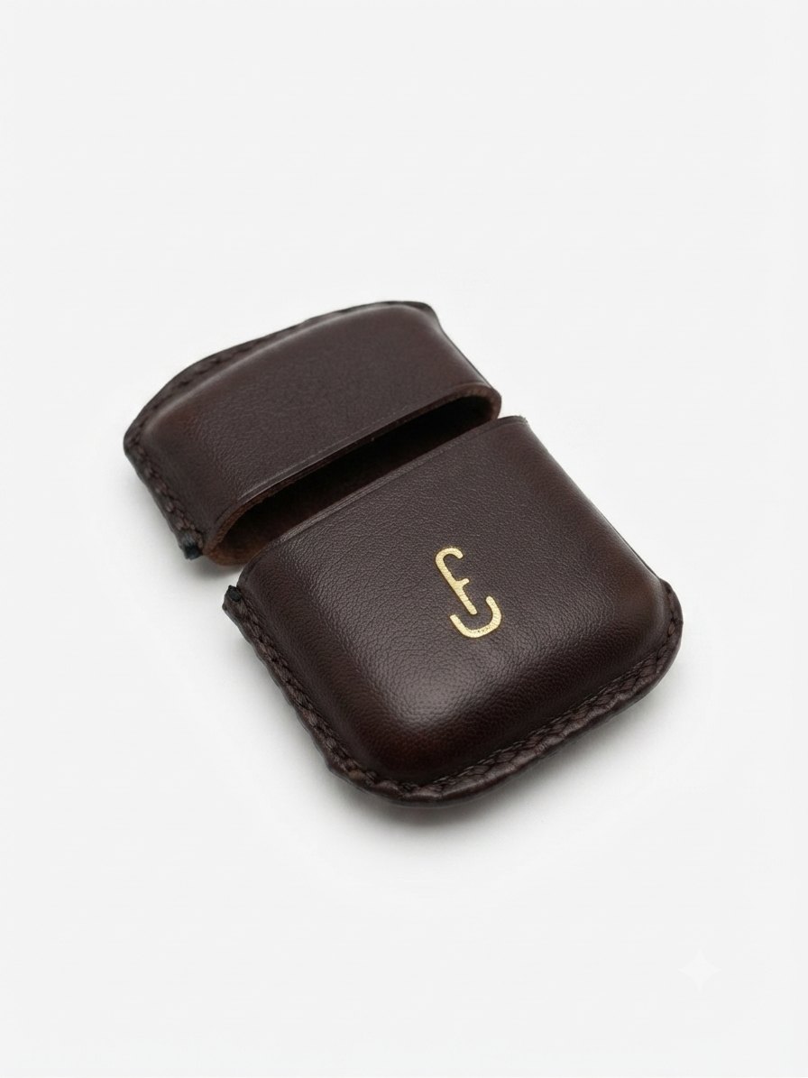 The Lighter Sleeve — dark brown full-grain leather cover for a standard Zippo, gold maker’s mark